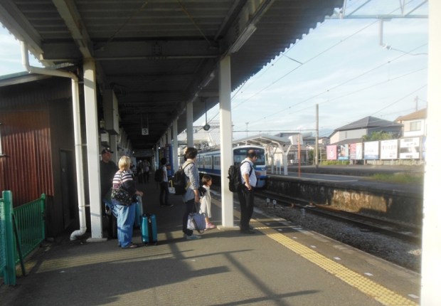 waiting for our train, as we leave Izukuni. 