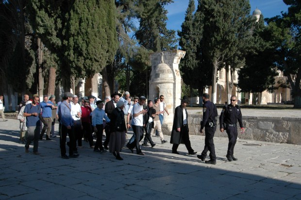 Minutes later a group of Jewish visitors entered the Temple Mount, under the watchful eye of security. 