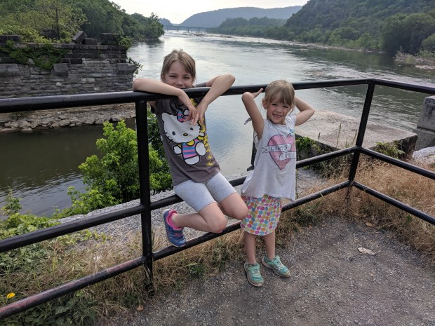 Lana and Audrey reenact a famous family photo of their uncles Drew and Grant when they were a similar age visiting another National Monument.