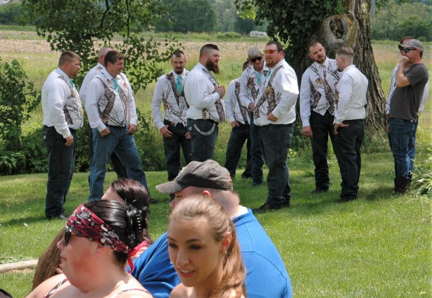  the groomsmen started to gather. 