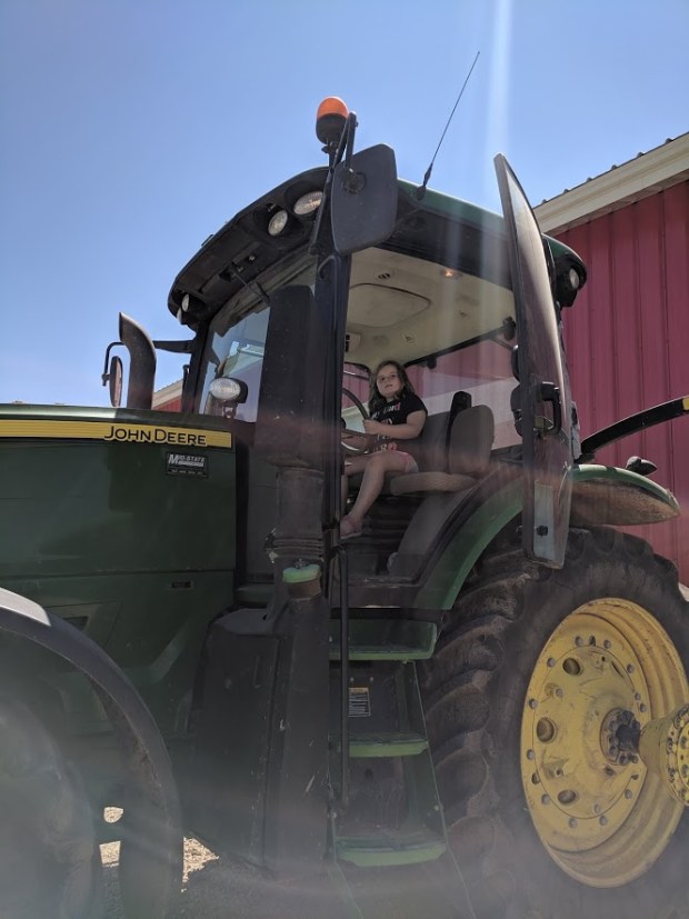 Eden also got to help with the hay harvest. Well, at least sit in a tractor for awhile.
