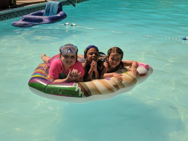 Cousins would play in the pool together all day, if they could. 
