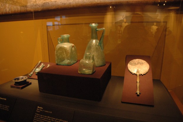 Some first century glass vessels and a mirror.