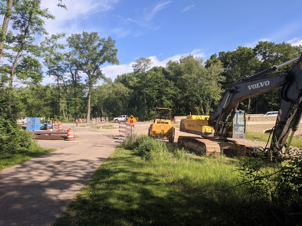 At the bottom of the hill, the west end of Raymond Road is still a construction zone. The trail goes right through the construction. 