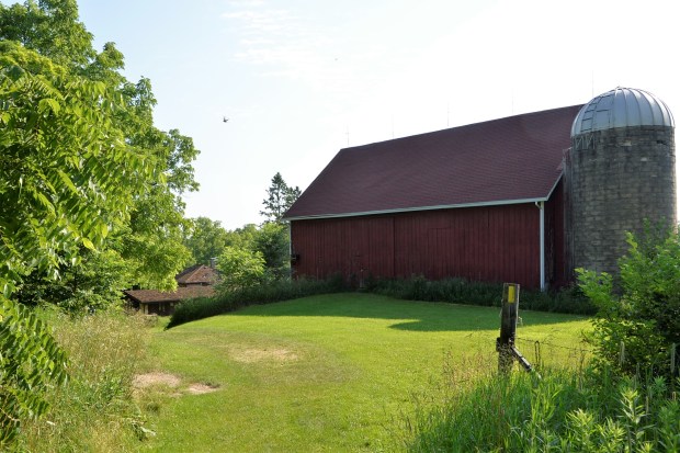 At the end of the prairie is a National Park Service Office building on the grounds of an old farm.