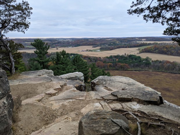 The well-trodden trail skirted the rim of the rock formation, offering spectacular views.