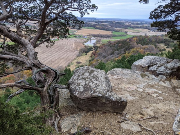 The well-trodden trail skirted the rim of the rock formation, offering spectacular views.