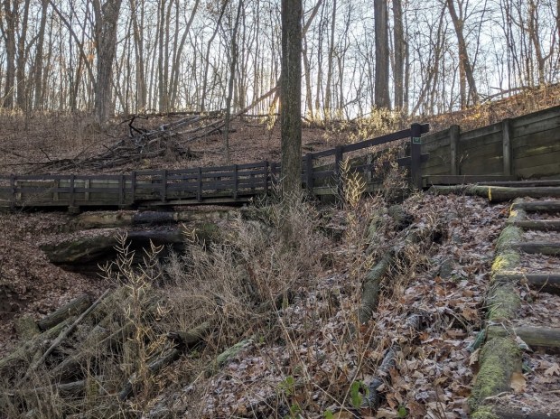 A bridge over a little water fall.