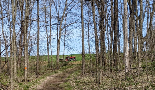 A farmer in the field preparing for fall planting.