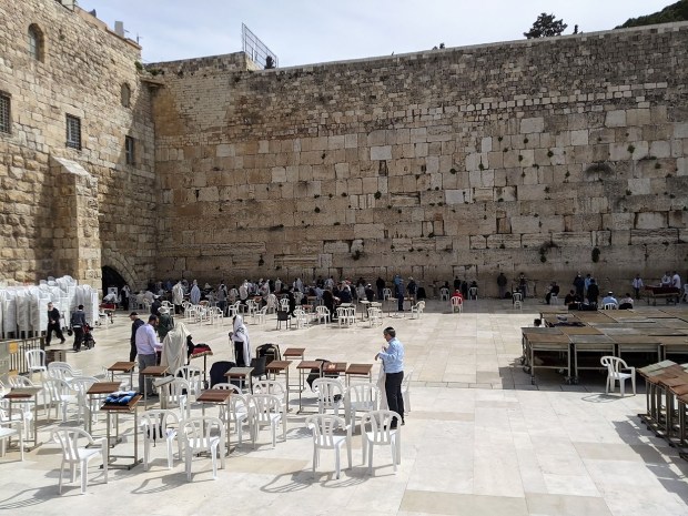 The Western Wall is the holiest site in Judaism today, and is usually busy with worshipers and people praying.