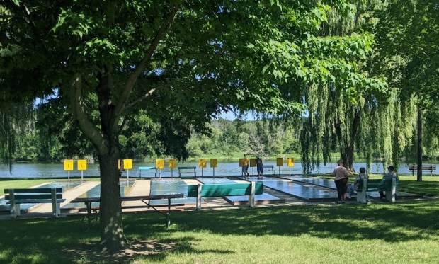 Then the trail passes through Riverside Park, which has lots of amenities including a Disc Golf course and a nifty looking Shuffleboard court.