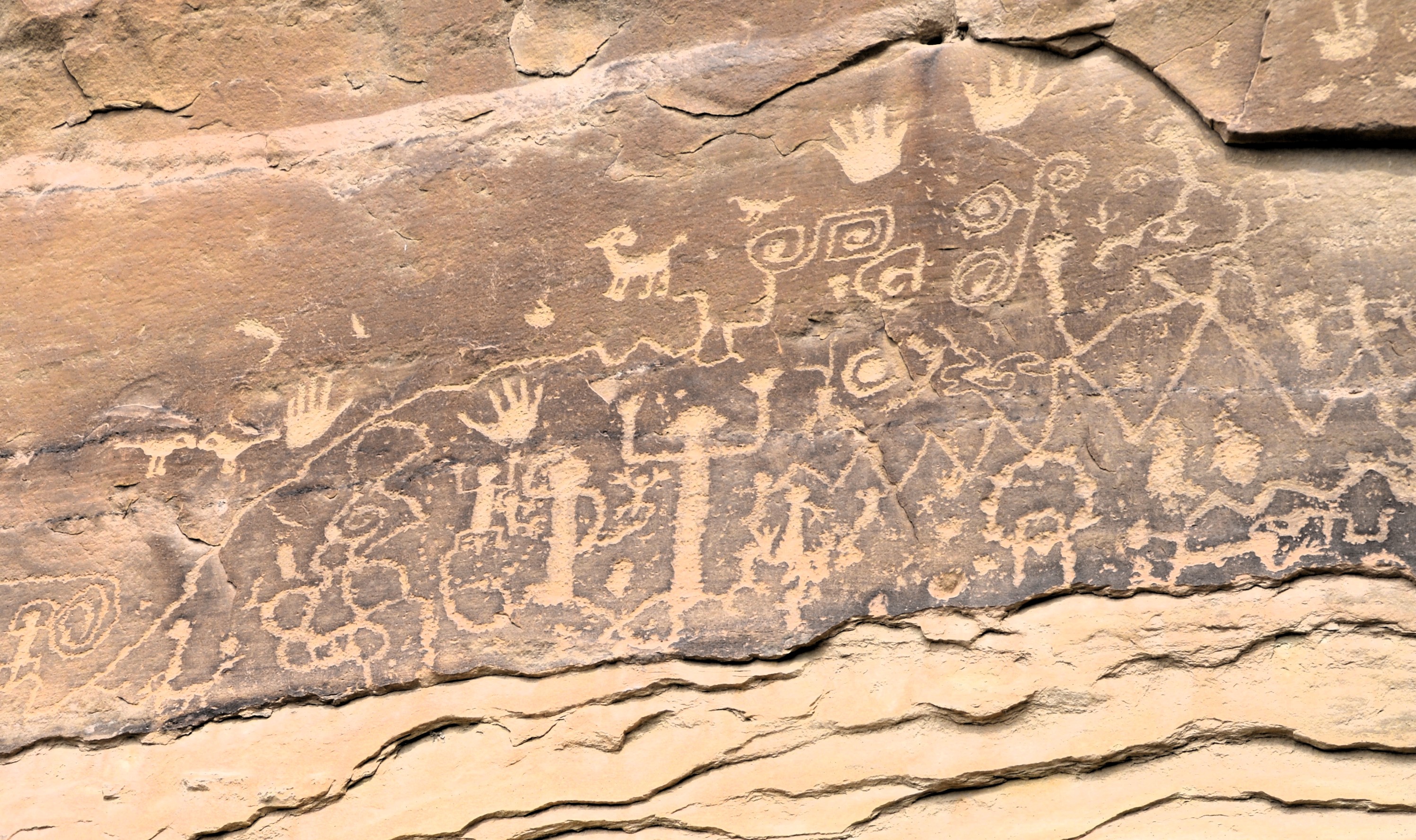 After hiking along the base of the cliff for about two miles, I finally came to the petroglyphs.