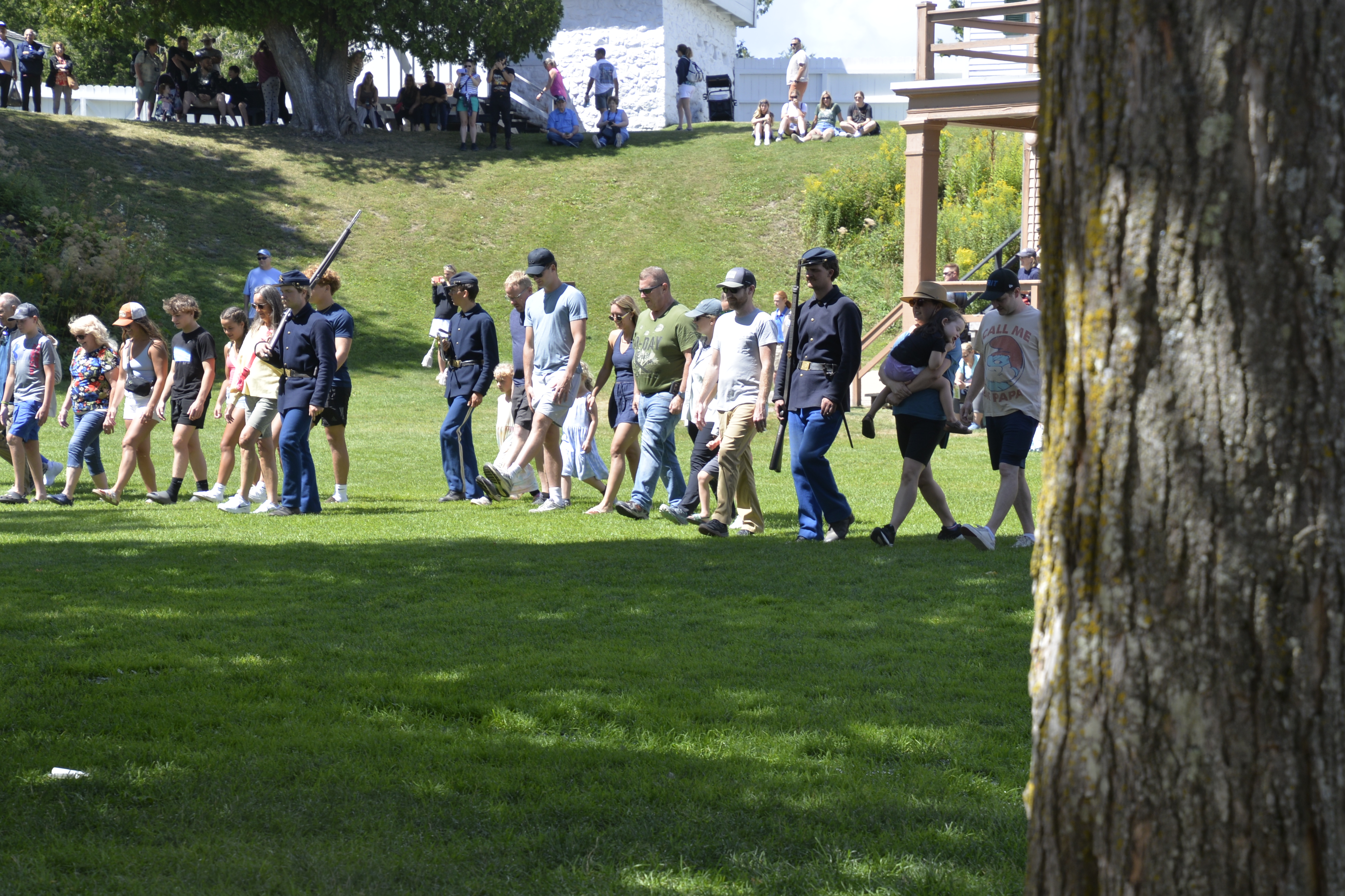 The cannon firing and the military drill demonstration drew lots of attention from the crowd.